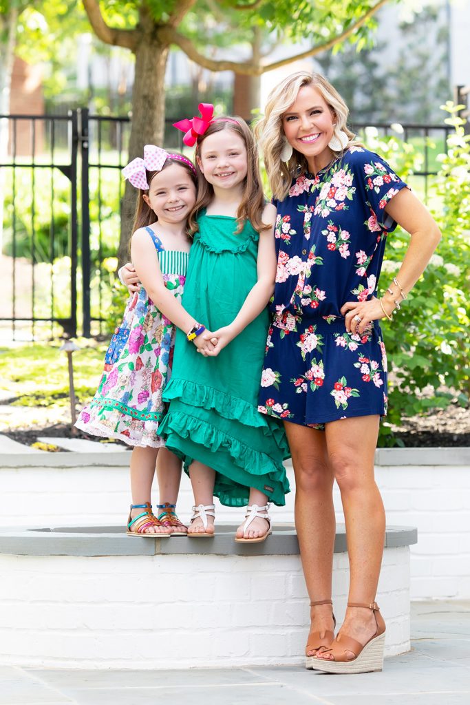 Ready, Set, SHOP! The Best in 4th of July Sales by popular Nashville fashion blog, Hello Happiness: image of mom and her two daughters standing outside and wearing Matilda Jane Clothing Be Bold Romper, Matilda Jane clothing Seriously Sweet Dress, and Matilda Jane Clothing Can Do Attitude Dress.