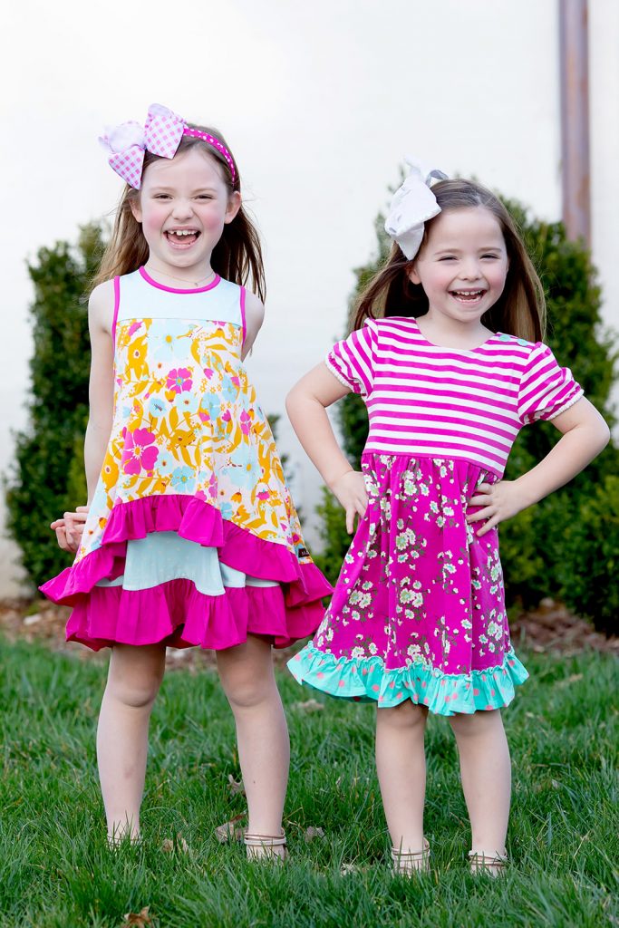 Ready, Set, SHOP! The Best in 4th of July Sales by popular Nashville fashion blog, Hello Happiness: image of two young girls standing outside wearing Matilda Jane Fun In The Sun Dresses and 