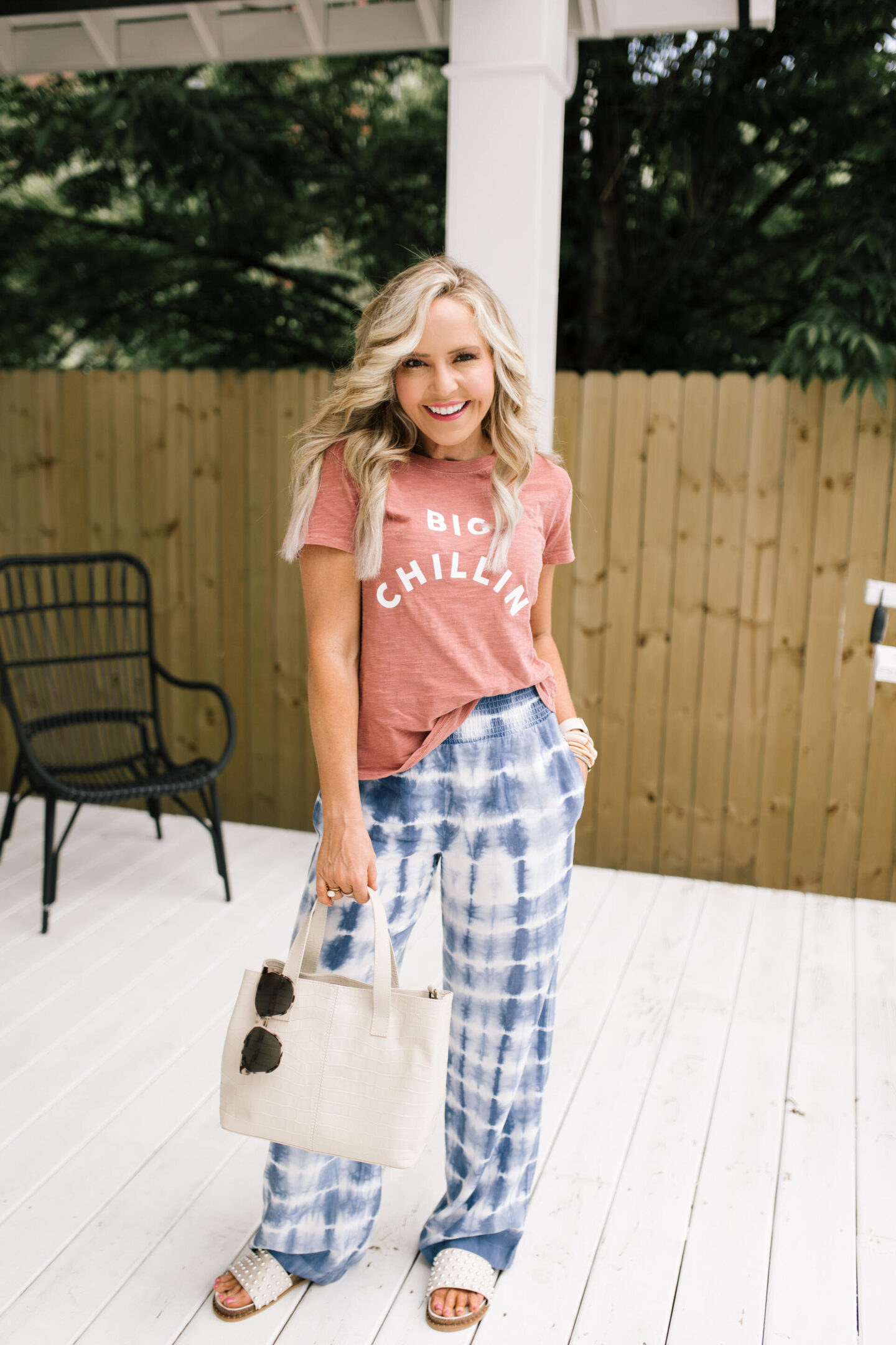 4th of July Deals by popular Nashville life and style blog, Hello Happiness: image of Natasha Stoneking wearing a Evereve Big Chillin tee and tie dye wide leg pants. 