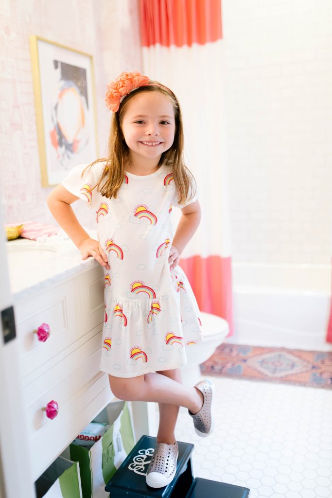 Caroline and Carson's Daily Style... Fall Fashion 2019 Edition by popular Nashville fashion blog, Hello Happiness: image of a little girl wearing a Nordstrom Tucker & Tate Print Jersey Dress, Nordstrom Floral Metallic Trim Headband, and Nordstrom Jefferson Bling Glitter Slip-On Vegan Sneaker.