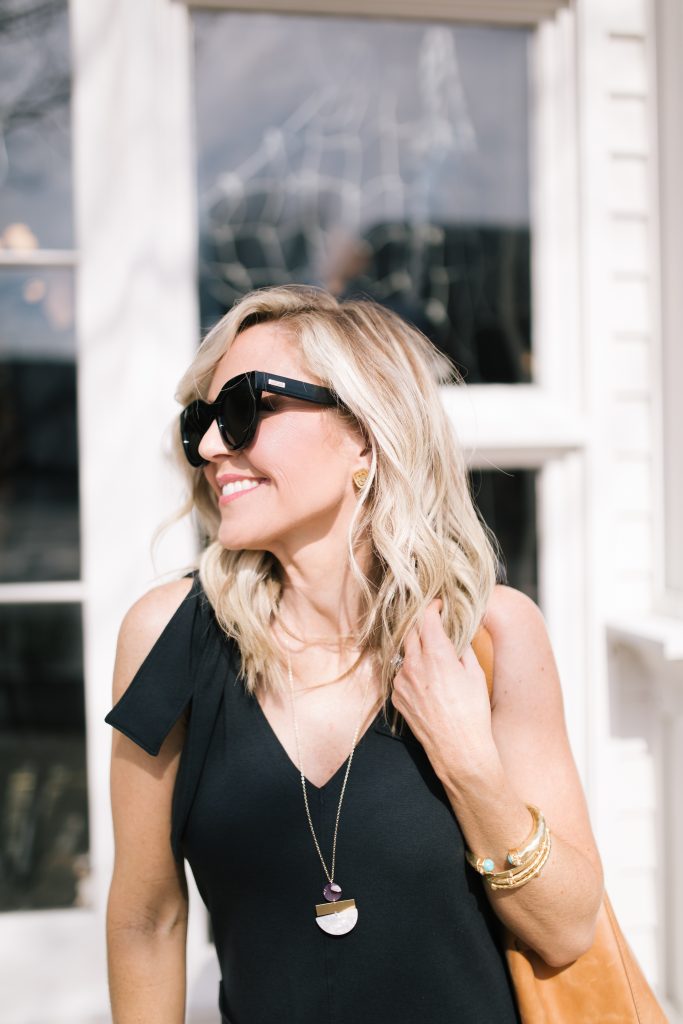 ABLE featured by top US fashion blog Hello! Happiness; Image of a woman wearing a black jumpsuit from ABLE