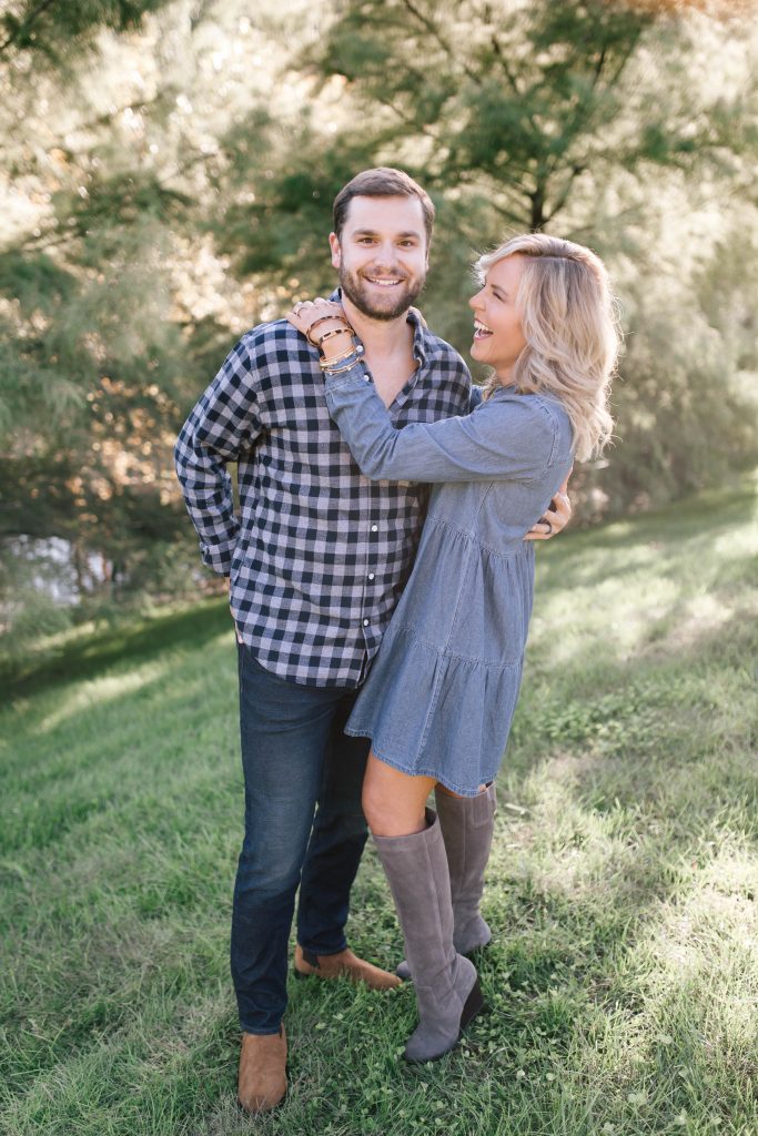 Date Night Outfit Ideas Done Right | Bonobos Style by popular Nashville fashion blog, Hello Happiness: image of a man walking with his wife outside and wearing a Bonobos button down shirt, Bonobos Stretch Eco Jeans and Bonobos The Alpern Chelsea Boot.
