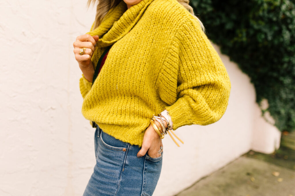 Anthropologie Sale by popular Nashville life and style blog, Hello Happiness: image of Natasha Stoneking wearing a Anthropologie cowl neck sweater. 