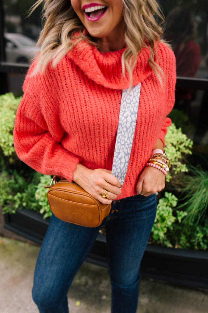 Anthropologie Sale by popular Nashville life and style blog, Hello Happiness: image of Natasha Stoneking wearing a Anthropologie cowl neck sweater and Supreme messenger bag. 