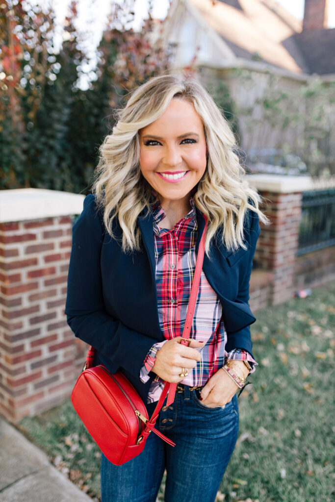 Year in Review by popular Nashville lifestyle blog, Hello Happiness: image of Natasha Stoneking standing outside and wearing a J. Crew blazer, J. Crew tartan button up, jeans, and carrying a red purse. 