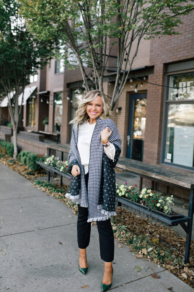 J. Crew Holiday by popular Nashville fashion blog, Hello Happiness: image of Natasha Stoneking standing outside and wearing a J. Crew double sided scarf, Ruffle Sleeve Top Satin Top in Crepe, Hayden Kick Out Crop Pant in Wool, Double Sided Scarf in Houndstooth Dot, and Green Embossed Leather Pumps.