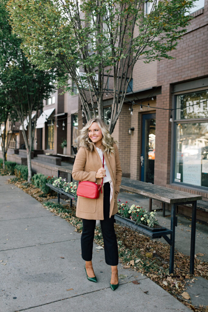 J. Crew Holiday by popular Nashville fashion blog, Hello Happiness: image of Natasha Stoneking standing outside and wearing a J. Crew Chateau Parka, Ruffle Sleeve Top Satin Top in Crepe, Hayden Kick Out Crop Pant in Wool, Double Sided Scarf in Houndstooth Dot, and Green Embossed Leather Pumps.