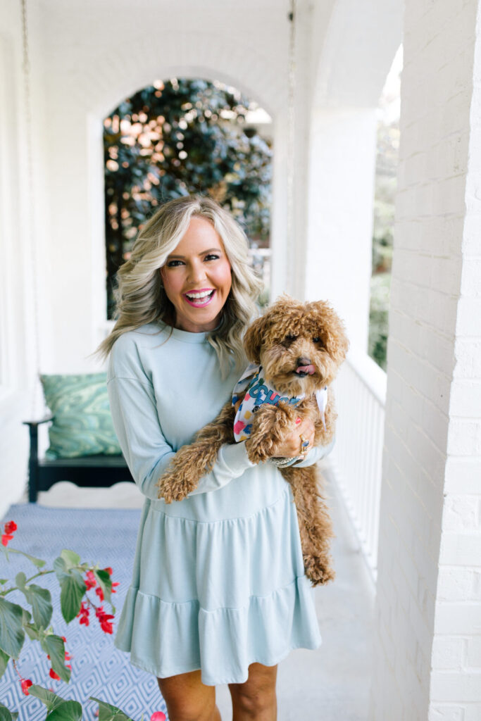 Clairebella Studio by popular Nashville life and style blog, Hello Happiness: image of Natasha Stoneking holding her dog that is wearing a Clairebella Studio and Hello Happiness dog bandana. 