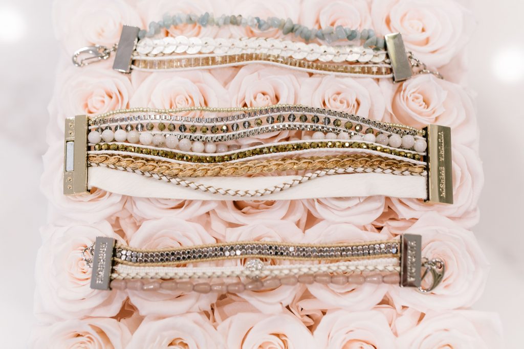 The Perfect Bracelet Stack with Victoria Emerson by popular Nashville fashion blog, Hello Happiness: image of 3 Victoria Emerson bracelets resting on top of some light pink roses.