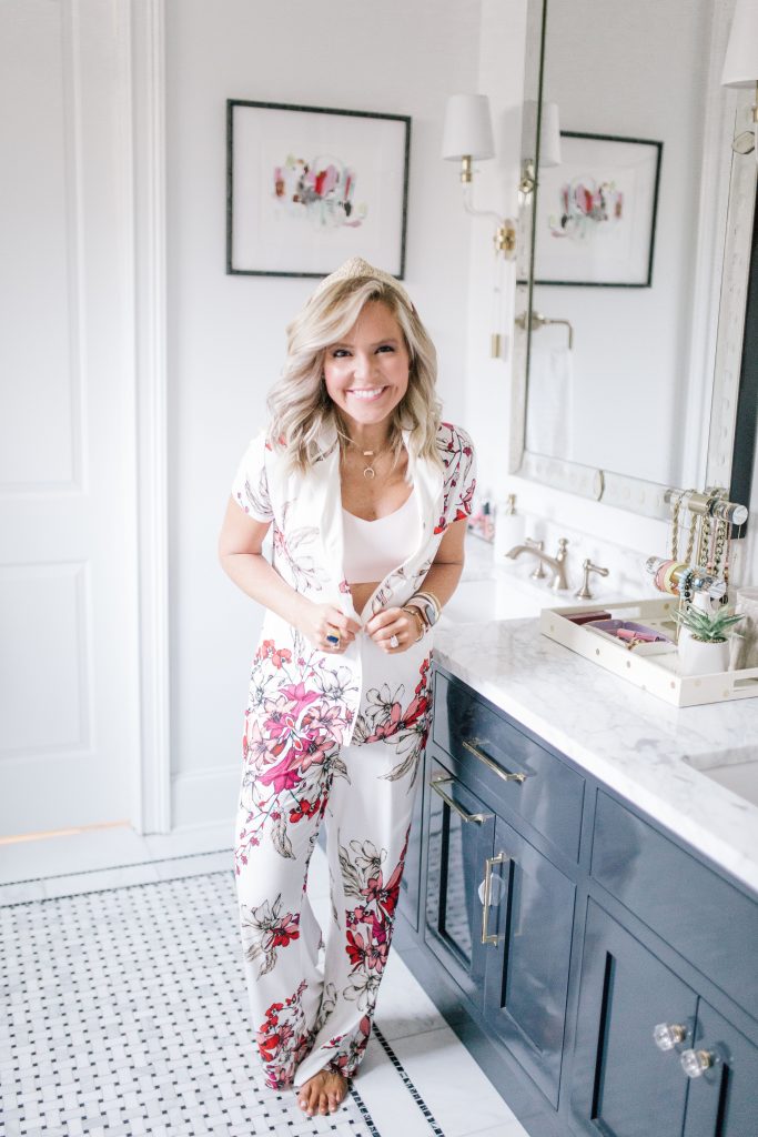 Pajama Time: Soma Friends and Family Sale by popular Nashville life and style blog, Hello Happiness: image of a woman standing in her bathroom and wearing a Soma COOL NIGHTS Short Sleeve Grosgrain Trim Notch Collar Pajama Top Floral Affair, Soma COOL NIGHTS Grosgrain Trim Pajama Pants Floral Affair, and ENBLISS Wireless Bralette.