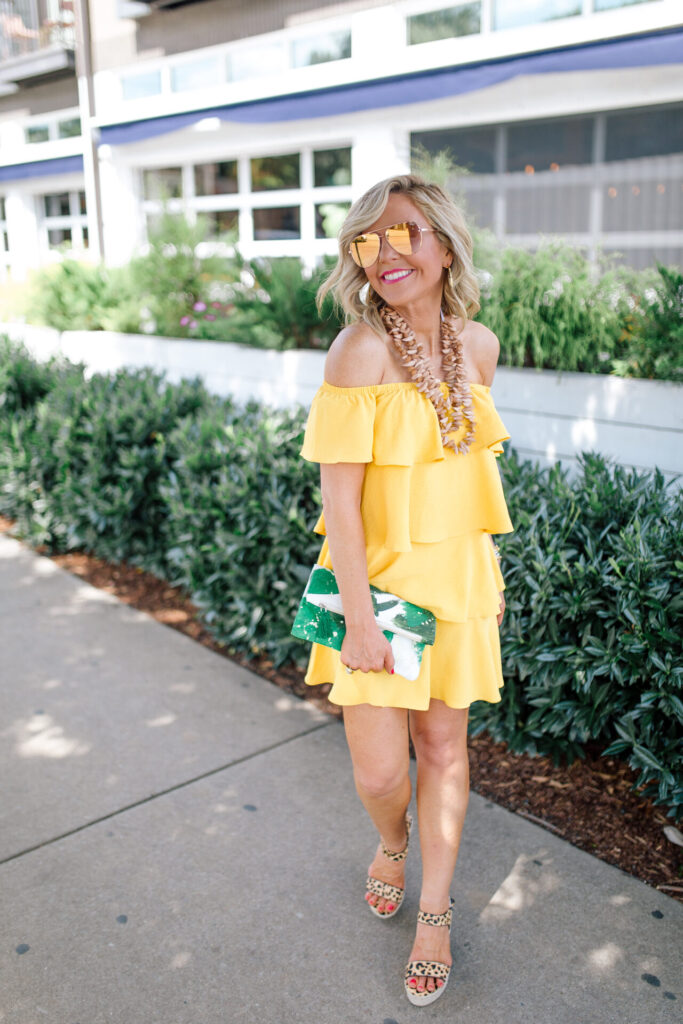 Independence Day Deals by popular Nashville life and style blog, Hello Happiness: image of Natasha Stoneking wearing a Gibson Look yellow off the shoulder ruffle dress. 