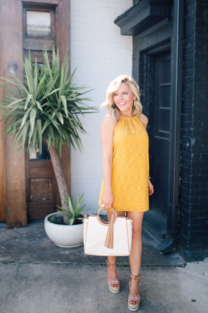 Independence Day Deals by popular Nashville life and style blog, Hello Happiness: image of Natasha Stoneking wearing a Gibson Look yellow eyelet halter dress. 