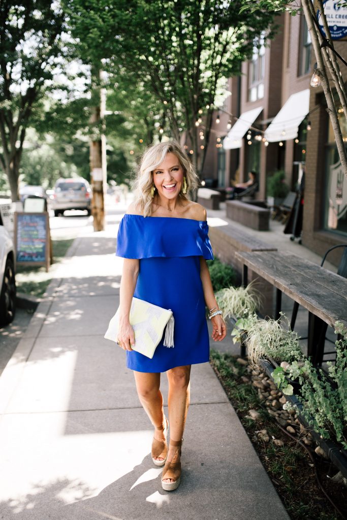 Blue Off the Shoulder Dress featured by top US fashion blog Hello! Happiness; Image of a woman wearing a Charles Henry dress, Marc Fisher wedges and Baublebar earrings.