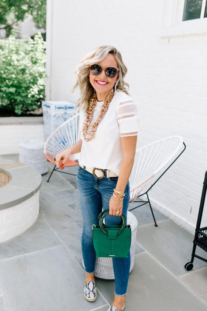 Snakeskin + Leopard...My Vince Camuto Favorites by popular Nashville blog, Hello Happiness: image of a woman outside wearing Jorrla Espadrille Flats and holding Vince Camuto Iggy Ring Handle Crossbody Bag.  