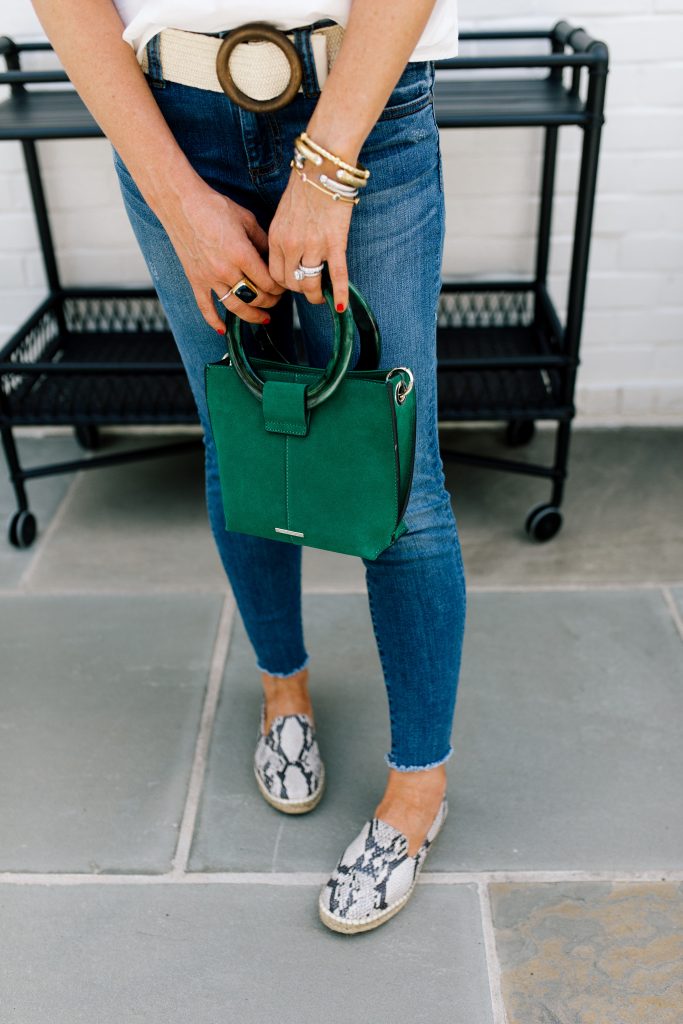 Snakeskin + Leopard...My Vince Camuto Favorites by popular Nashville blog, Hello Happiness: image of a woman outside wearing Jorrla Espadrille Flats and holding Vince Camuto Iggy Ring Handle Crossbody Bag. 