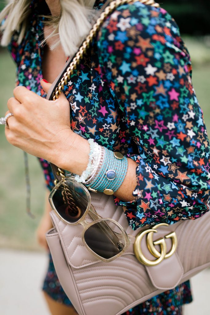 My Favorite Arm Candy...The BOGO Victoria Emerson Sale by popular Nashville fashion blog, Hello Happiness: image of a woman wearing a Victoria Emerson ALENTEJO stack bracelets and ShopBop Le Specs sunglasses.