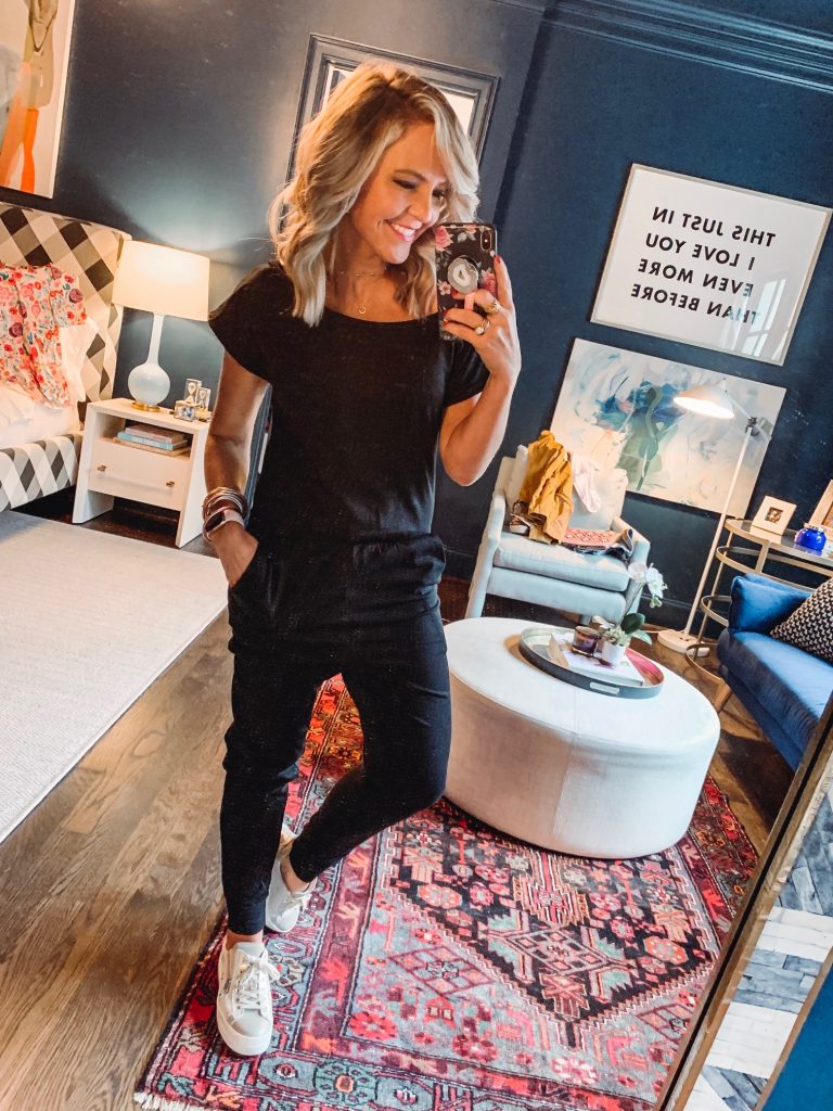 My Current Amazon Favorites by popular Nashville fashion blog, Hello Happiness: image of a woman standing in her room and wearing a PRETTYGARDEN Women's Loose Solid Off Shoulder Elastic Waist Stretchy Long Romper Jumpsuit with Pockets. 