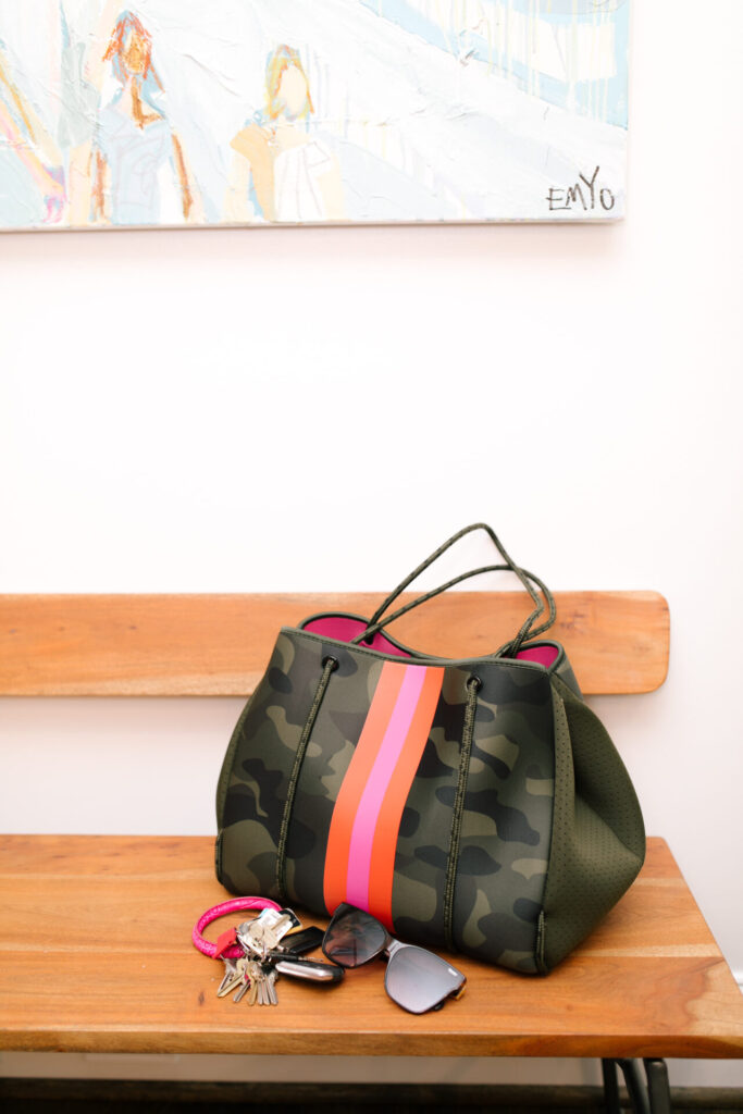 Social Threads by popular Nashville fashion blog, Hello Happiness: image of a Social Threads Hello Happiness Camo Striped Neoprene Tote.