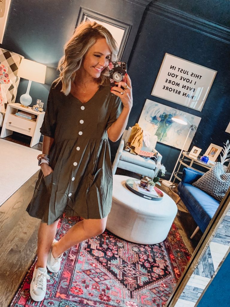 My Current Amazon Favorites by popular Nashville fashion blog, Hello Happiness: image of a woman standing in her room and wearing a CILKOO Women V Neck Button Down Loose Swing Casual Short T-Shirt Dress.