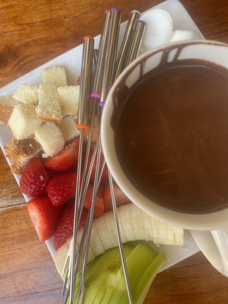 Rosemary Beach by popular Nashville travel blog, Hello Happiness: image of fruit and some chocolate fondu. 