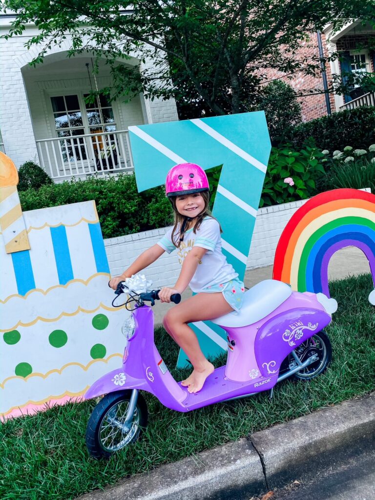Year in Review by popular Nashville lifestyle blog, Hello Happiness: image of a young girl on a electric scooter. 