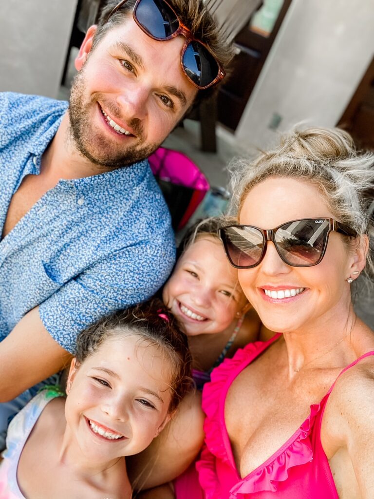 Year in Review by popular Nashville lifestyle blog, Hello Happiness: image of Natasha Stoneking, her husband, and her two daughters standing together. 