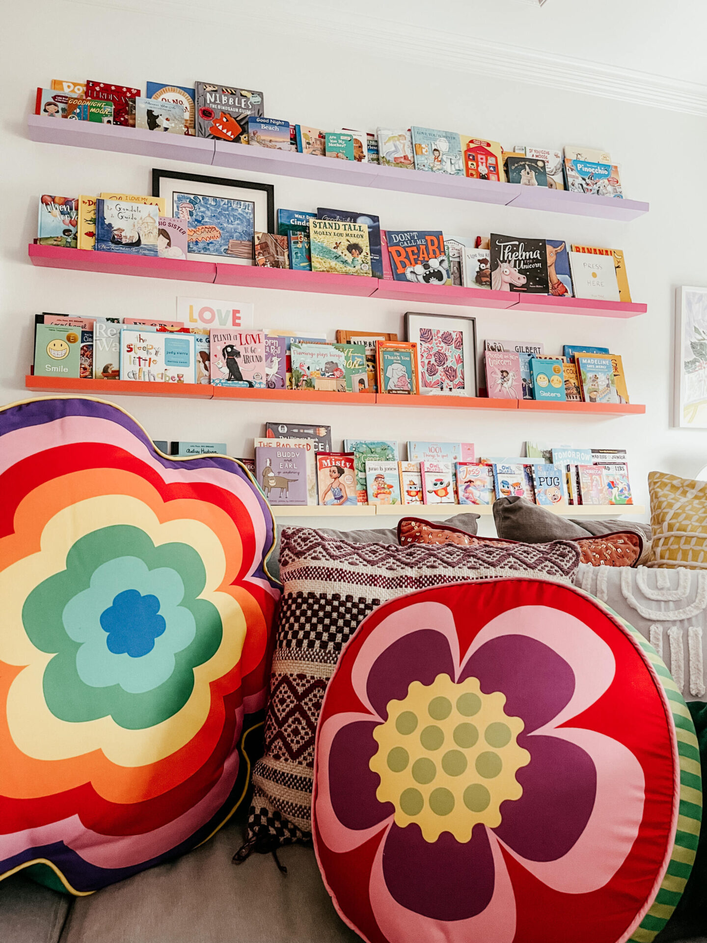 Smarts and Crafts by popular Nashville lifestyle blog, Hello Happiness: image of smarts and crafts rainbow flower pillows. 