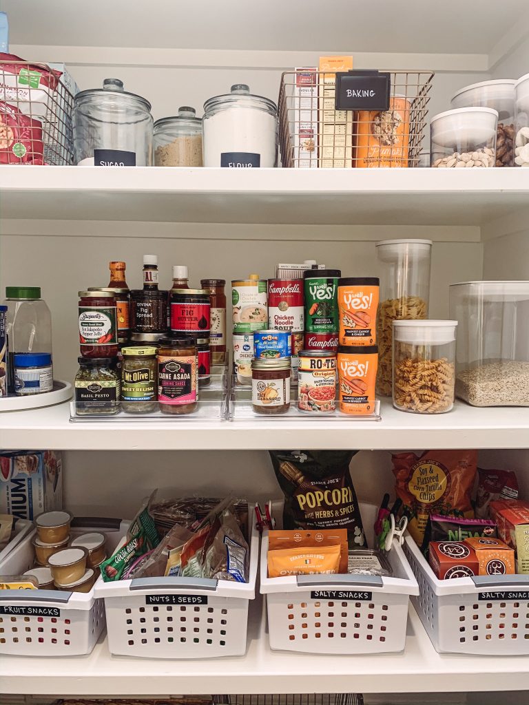 Kitchen Pantry Organization by popular Nashville life and style blog, Hello Happiness: image of a pantry organized with baskets from The Container Store. 