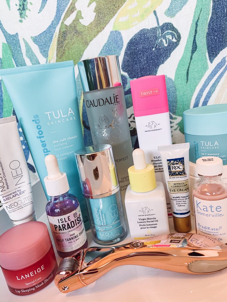 My Nighttime Skincare Routine | 2020 Edition by popular Nashville life and style blog, Hello Happiness: image of Tula skincare products, Roc eye cream, Caudalie Brightening Glycolic Essence, Kate Somerville acne treatment, Drunk Elephant Virgin Marula oil, and a micro needling tool. 