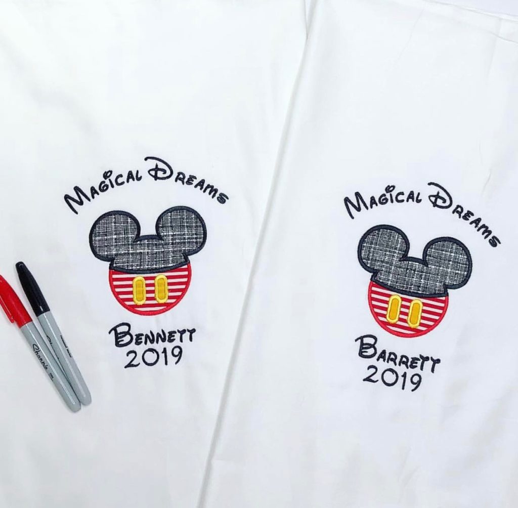 What to Pack for a Disney Cruise by popular US life and style blog, Hello Happiness: image of a Elegant Goods Shop Embroidered Micky Mouse Ears pillow cases and red and black sharpies.