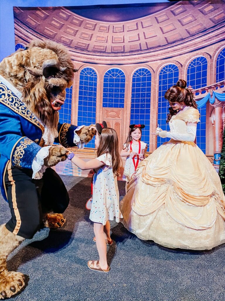 Disney Creators Celebration by popular Nashville lifestyle blog, Hello Happiness: image of two girls with Belle and the Beast. 