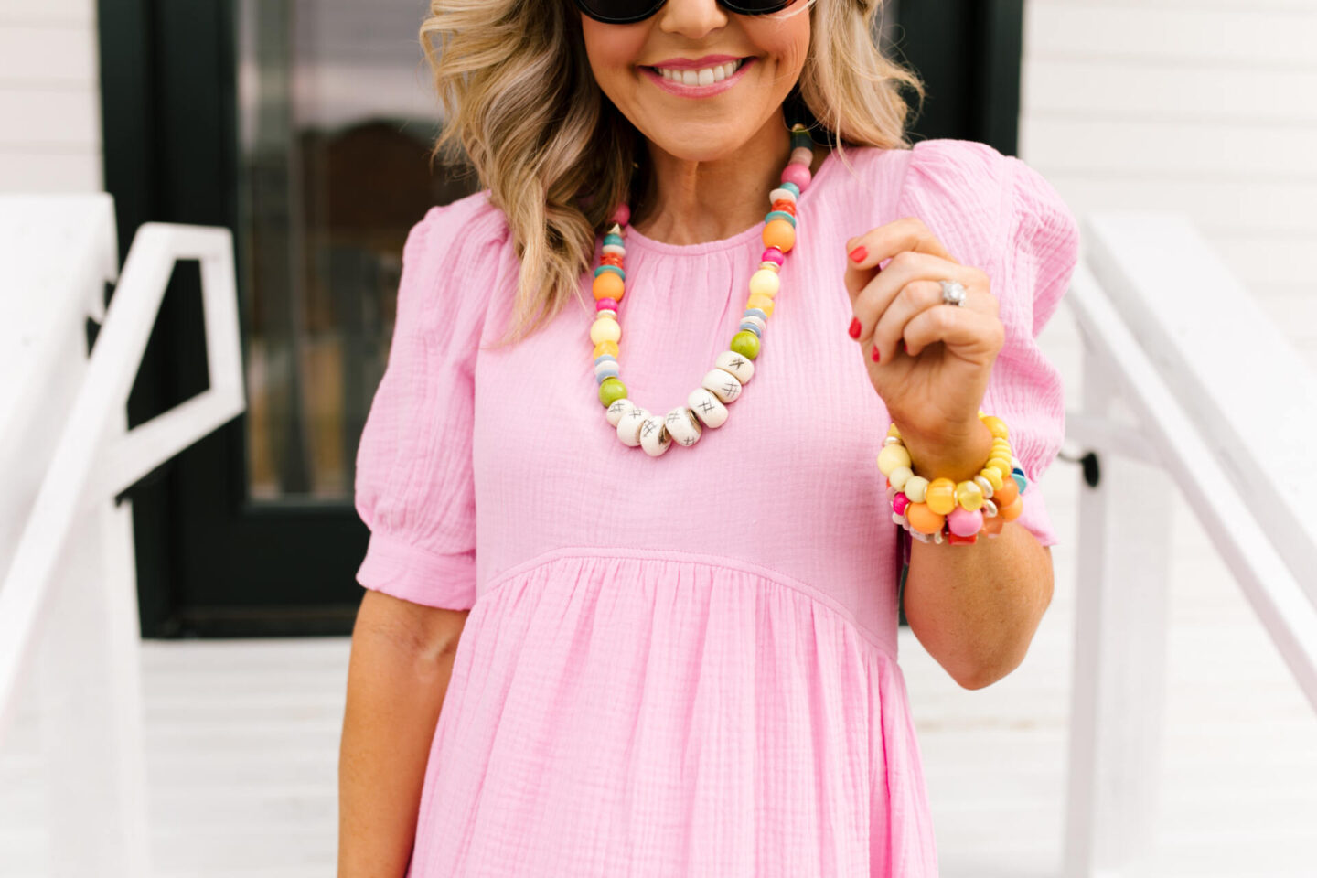 Accessory Concierge by popular Nashville fashion blog, Hello Happiness: image of Natasha Stoneking wearing a Accessory Concierge Danica Dress, Cake by the Ocean bracelet, Walking on Sunshine bracelet, Camilla Heels, and holding a Mallorca tote. 