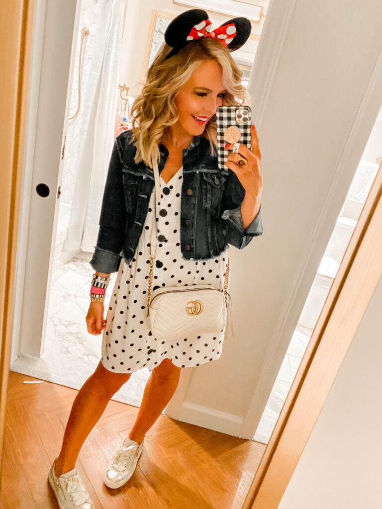 Disney Creators Celebration by popular Nashville lifestyle blog, Hello Happiness: image of a woman wearing a ASOS v neck button through mini smock dress in mono spot, Able MARGARIT RAW EDGE JACKET, Amazon FANYITY Minnie Mouse ears, Nero Giardini shoes, and Nordstrom Gucci Small Matelassé Leather Camera Bag. 