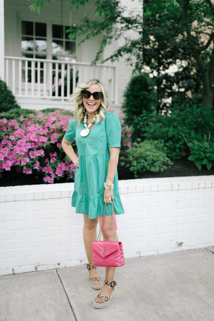 Memorial Day Sales by popular Nashville fashion blog, Hello Happiness: image of a woman wearing an ASOS green smocked dress, Audrina Espadrilles, Palette necklace, and carrying a YSL lou lou bag. 