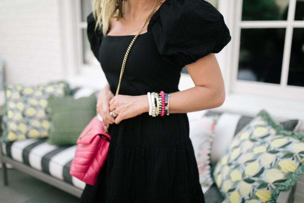 Pink Bags by popular Nashville fashion blog, Hello Happiness: image of Natasha Stoneking wearing a black puff sleeve dress, black sunglasses, Steve Madden RUBIE NATURAL MULTI, and holding a Yves Saint Laurent LOULOU SMALL IN MATELASSÉ “Y” LEATHER.