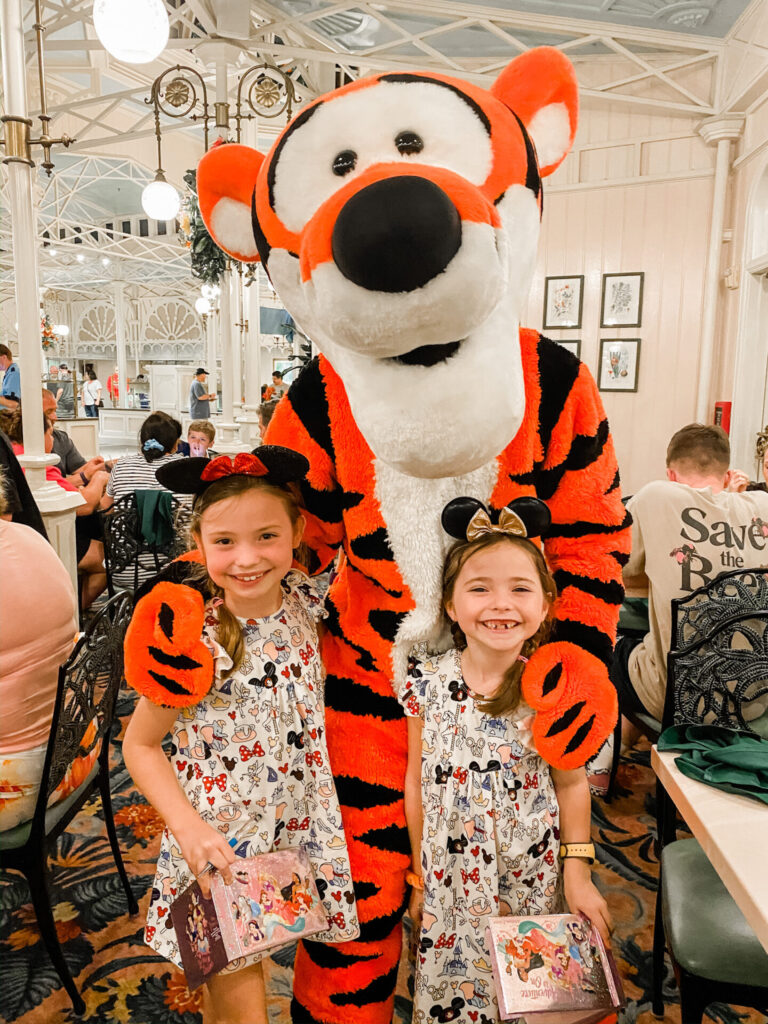 Disney Creators Celebration by popular Nashville lifestyle blog, Hello Happiness: image of two girls standing with Tigger. 