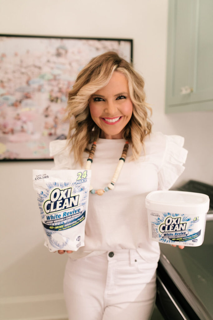 Year in Review by popular Nashville lifestyle blog, Hello Happiness: image of Natasha Stoneking wearing an all white outfit and holding Oxi Clean products in her hands. 