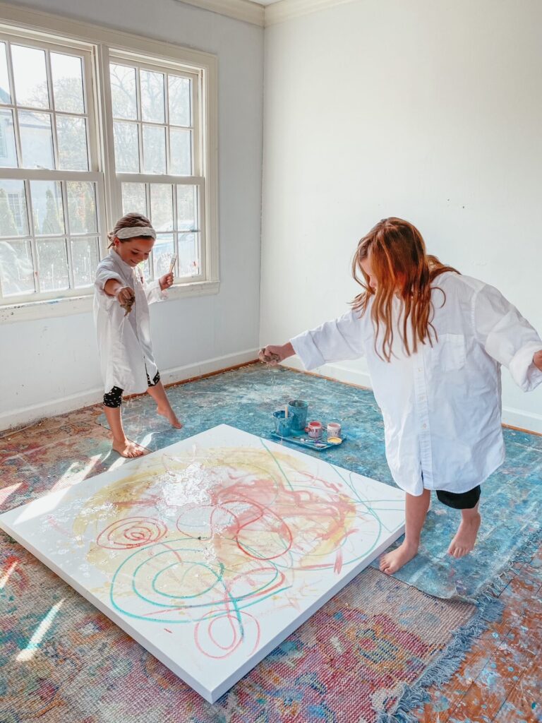 Year in Review by popular Nashville lifestyle blog, Hello Happiness: image of two young girls painting together. 