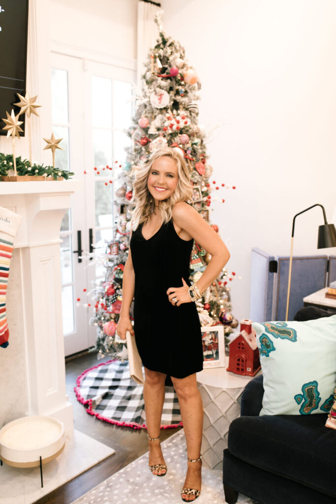 Holiday Collection by popular Nashville fashion blog, Hello Happiness: image of Natasha Stoneking wearing a Gibson x Glam Velvet Shift Dress, Black Bow Hair Clip, and gold bracelets. 