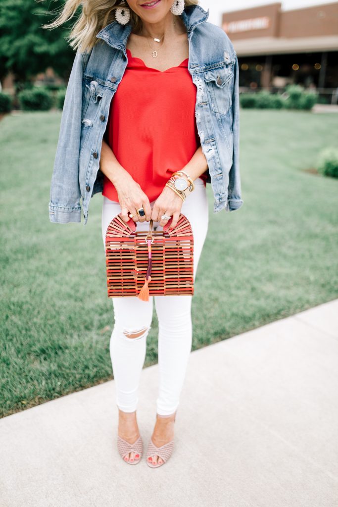 Ready, Set, SHOP! The Best in 4th of July Sales by popular Nashville fashion blog, Hello Happiness: image of woman standing outside on a sidewalk and wearing VINCE CAMUTO GEDDA – LASER-CUT BLOCK-HEEL SANDAL and holding a Vince Camuto Bayne – Bamboo Cage Clutch.