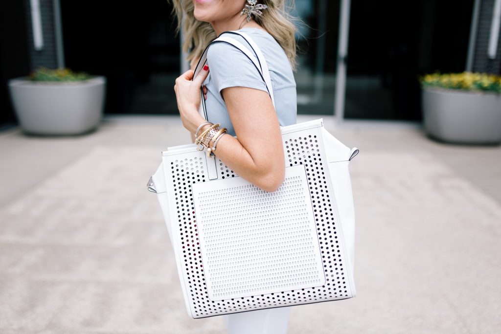 Vince Camuto Accessories featured by top US fashion blog Hello! Happiness; Image of a woman wearing white denim, Vince Camuto shoes and a Vince Camuto bag.