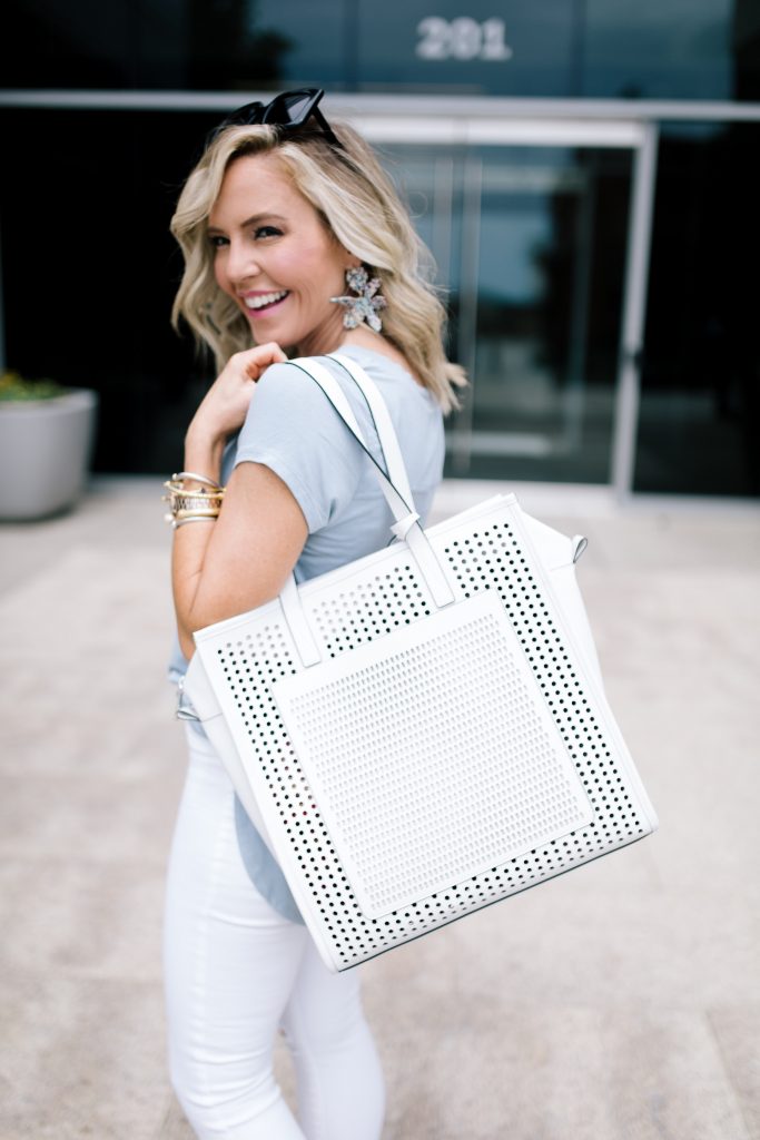 Vince Camuto Accessories featured by top US fashion blog Hello! Happiness; Image of a woman wearing white denim, Vince Camuto shoes and a Vince Camuto bag.