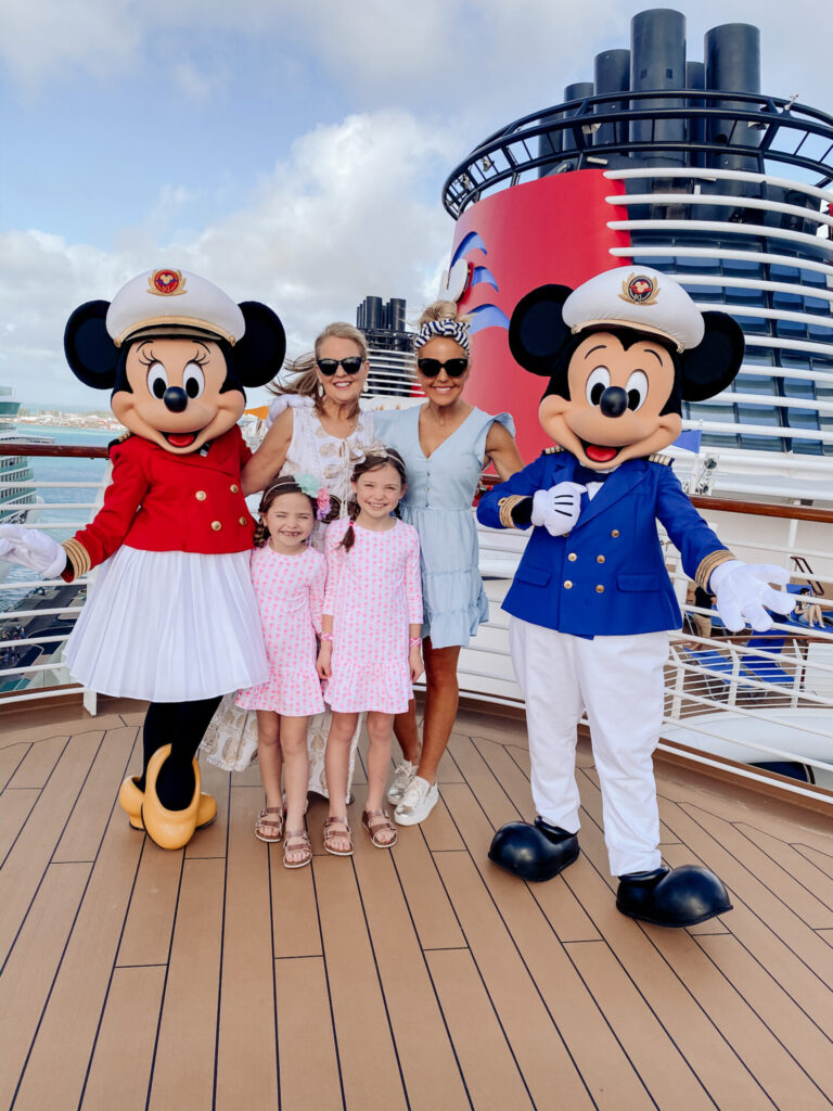 Disney Creators Celebration by popular Nashville lifestyle blog, Hello Happiness: image of two girls and their mom and grandma standing with Mickey and Minnie Mouse on the Disney Cruise Ship. 