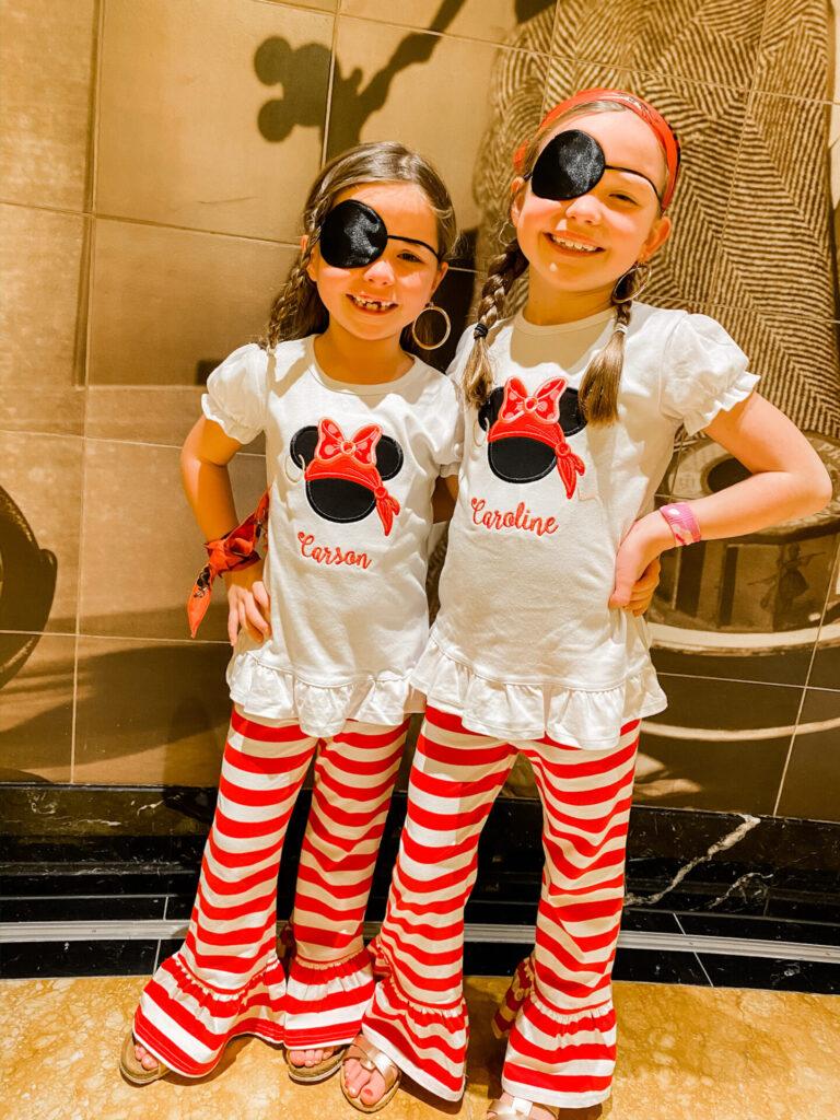 Disney Creators Celebration by popular Nashville lifestyle blog, Hello Happiness: image of two girls wearing matching Elegant Goods Shop applique pirate party outfits. 