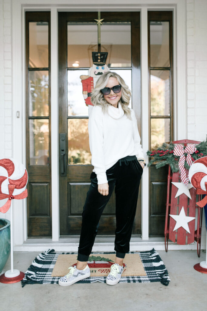 Holiday Collection by popular Nashville fashion blog, Hello Happiness: image of Natasha Stoneking wearing a Gibson x Glam ribbed turtleneck sweater with velvet joggers and sneakers. 