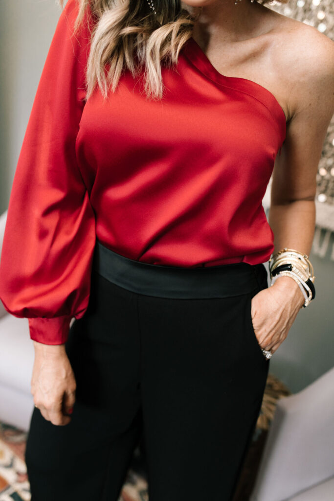 Holiday Collection by popular Nashville fashion blog, Hello Happiness: image of Natasha Stoneking wearing a Gibson x Glam one shoulder satin top and wide leg satin pants. 