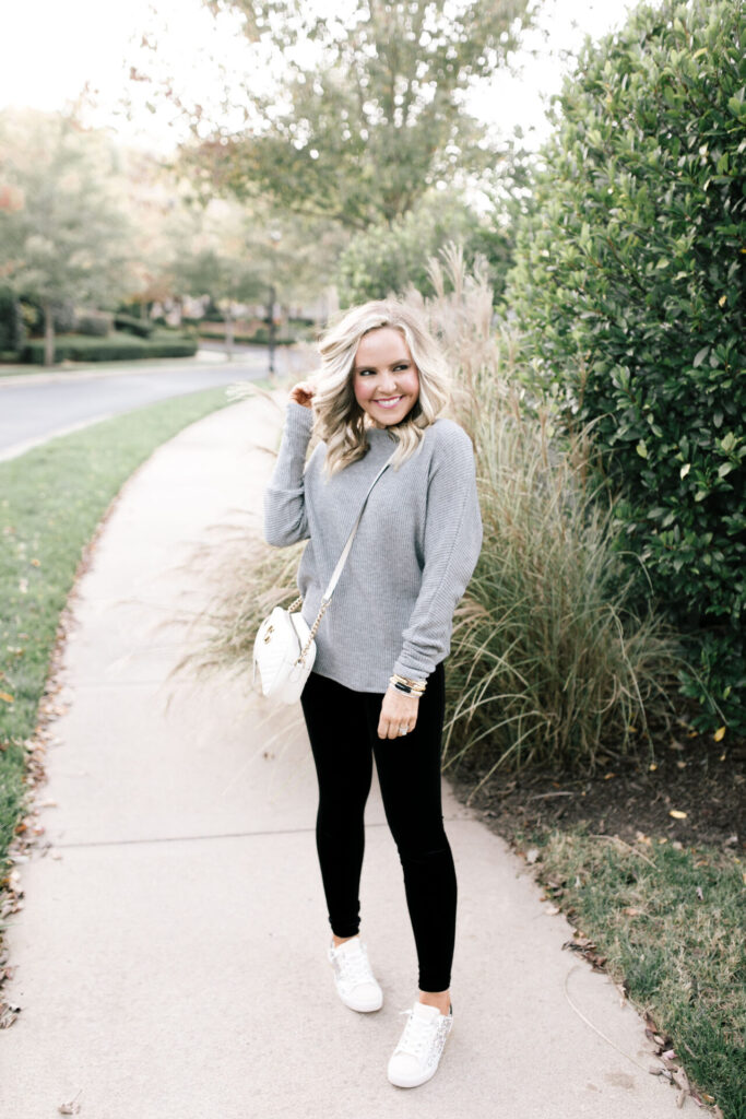Holiday Collection by popular Nashville fashion blog, Hello Happiness: image of Natasha Stoneking wearing a Gibson x Glam Mom in Style velvet legging with a grey sweater and sneakers. 