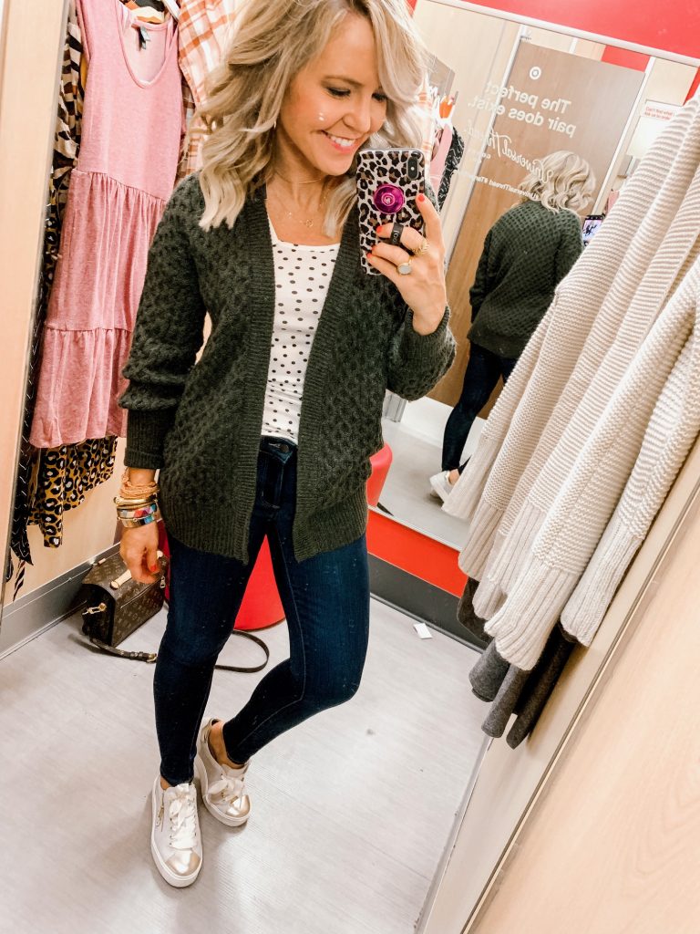 The Friday Five...by popular Nashville life and style blog, Hello Happiness: image of a woman trying on a Target Women's Honeycomb Long Sleeve Open Neck Layering Sweater, Target Women's High-Rise Skinny Jeans, and Target Women's Slim Fit Polka Dot Scoop Neck Any Day Tank Top.