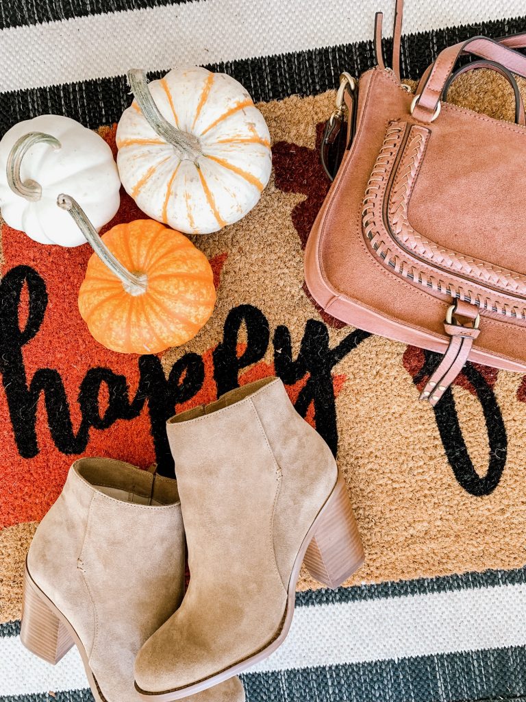 The Friday Five...by popular Nashville life and style blog, Hello Happiness: image of some small pumpkins, a fall door mat, a purse, and some booties. 