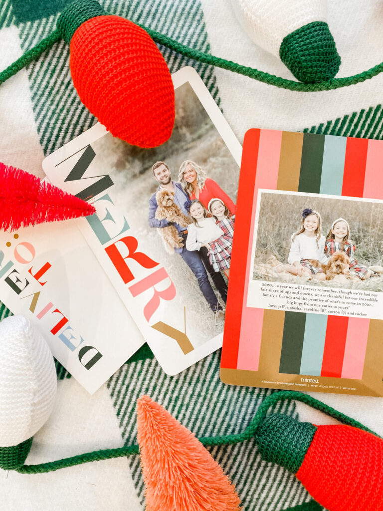 Minted Christmas Cards by popular Nashville lifestyle blog, Hello Happiness: image of Minted Christmas cards, knit Christmas lights garland, and an orange bottle brush Christmas tree. 